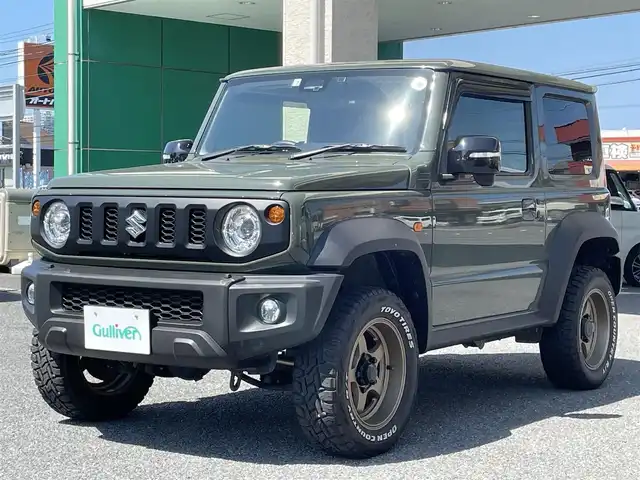 スズキ ジムニー シエラ JC 茨城県 2022(令4)年 2.9万km ジャングルグリーン ナビ（AM.FM.DVD.USB.BT）/車線逸脱警報/デュアルセンサーブレーキ/ヒルディセントコントロールスイッチ/トランスファーレバー/シートヒーター/電動格納式ミラー/スタッドレス付き/バックカメラ/社外マフラー/社外ホイール