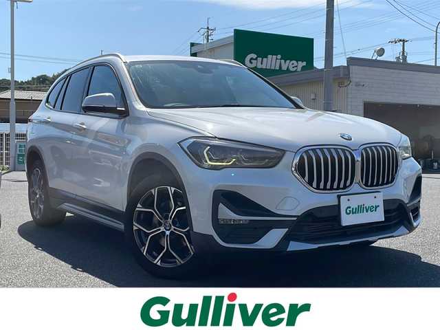 ＢＭＷ Ｘ１ sDrive 18i Xライン 山口県 2019(令1)年 7.5万km パール ワンオーナー/前後ドライブレコーダースマートキー/プッシュスタート/ルームミラー型ETC/純正HDDナビ/(CD/DVD/BT/ラジオ)/電子パーキングブレーキ/オートエアコン/オートライト/シートヒーター/前席パワーシート/クリアランスソナー/アイドリングストップ/リモートタッチ/レーダークルーズコントロール/パワーバックドア/純正アルミホイール/純正フロアマット/保証書/取扱説明書/記録簿