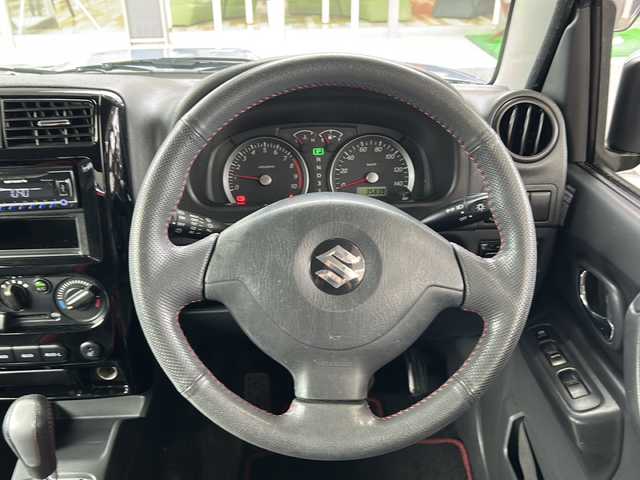 スズキ ジムニー クロスアドベンチャー 鳥取県 2013(平25)年 3.6万km ブリーズブルーメタリック 純正キーレス/パートタイム４WD/専用合革シート（ヒーター）/背面ハードカバー/メッキグリル/メッキアンダーカバー/フォグライト/革巻ハンドル/社外１６インチAW/純正ラジアル4本積込/プライバシーガラス/社外CD/保証書・取説