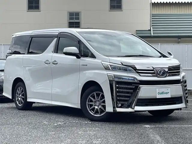 トヨタ ヴェルファイア ハイブリット ZR 大阪府 2018(平30)年 10.5万km ホワイトパールクリスタルシャイン ワンオーナー/サンルーフ/純正ナビ/夏タイヤ付純正AW有/BT/CD/DVD/SD/TV/バックカメラ/純正フリップダウンモニター(V12T-R66C)/前後ドライブレコーダー/レーダー探知機(GWR73sd)/本革シート/前席パワーシート/前席シートヒーター/前席エアシート/N席/２列目オットマン/電動リアゲート/追従機能付きクルーズコントロール/レーンキープアシスト/コーナーセンサー/LEDヘッドライト/フロントフォグ/オートハイビーム/スペアキー/ETC2.0