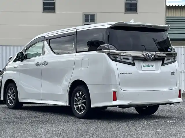 トヨタ ヴェルファイア ハイブリット ZR 大阪府 2018(平30)年 10.5万km ホワイトパールクリスタルシャイン ワンオーナー/サンルーフ/純正ナビ/夏タイヤ付純正AW有/BT/CD/DVD/SD/TV/バックカメラ/純正フリップダウンモニター(V12T-R66C)/前後ドライブレコーダー/レーダー探知機(GWR73sd)/本革シート/前席パワーシート/前席シートヒーター/前席エアシート/N席/２列目オットマン/電動リアゲート/追従機能付きクルーズコントロール/レーンキープアシスト/コーナーセンサー/LEDヘッドライト/フロントフォグ/オートハイビーム/スペアキー/ETC2.0