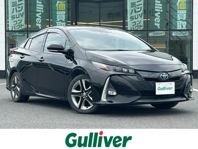 トヨタ プリウス ＰＨＶ A プレミアム 岡山県 2020(令2)年 10.7万km アティチュードブラックマイカ 登録時走行距離106815km/純正9インチナビ/フルセグTV(AM.FM.CD.DVD.TV.BT)/全方位カメラ/ETC2.0/ブラインドスポットモニター/ドライブレコーダー/シートヒーター/エアシート/ステアリングヒーター/クリアランスソナー/衝突軽減ブレーキ/横滑り防止装置/レーダークルーズコントロール/レーンキープアシスト/オートライト/オートマチックハイビーム/アイドリングストップ/17インチ純正AW/純正フロアマット/レザーシート/D席パワーシート/社外AW付スタッドレスタイヤ4本車載