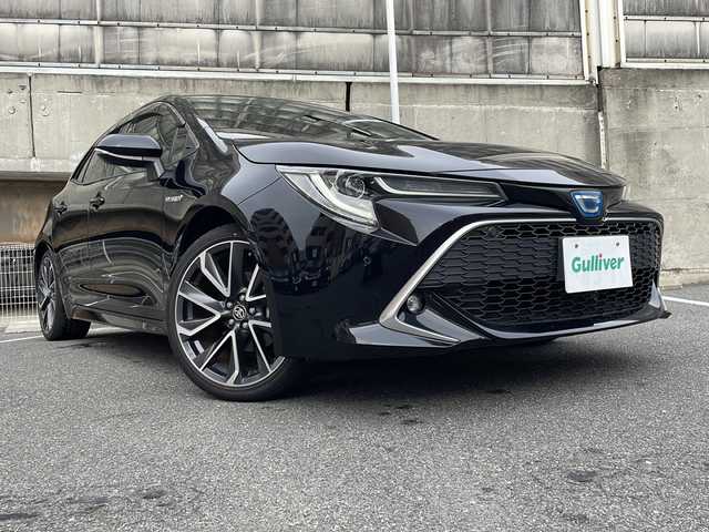 トヨタ カローラ スポーツ ハイブリッドG Z 愛知県 2018(平30)年 6.6万km アティチュードブラックマイカ ワンオーナー/純正ナビ/フルセグTV・Bluetooth・CD・DVD・SD・AM・FM/バックカメラ/Toyota Safety Sense/・レーダークルーズコントロール/・プリクラッシュセーフティー/・クリアランスソナー/・ブラインドスポットモニター/・レーントレーシングアシスト/・ロードサインアシスト/・先行車発進告知機能/・リヤクロストラフィックアラート/・パーキングサポートブレーキ/AC100V電源/オートブレーキホールド/オートハイビーム/LEDヘッドライト/フォグランプ/ヘッドライトレベライザー/ビルドインETC/純正18インチAW/ステアリングスイッチ/純正フロアマット/純正ドアバイザー/ISOFIX/ディーラー整備記録簿（H30.R1.R2.R3.R4.R5）/保証書/取扱説明書