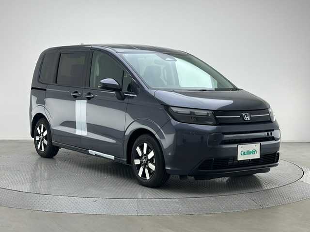 ホンダ フリード ハイブリット e:HEV AIR EX 兵庫県 2025(令7)年 0.1千km メテオロイドグレーメタリック e:HEV エアー　6人/登録済み未使用車　/9インチナビ　LXM-242ZFNI(207680円)/純正メモリナビ（フルセグ、Bluetooth、カープレイ）/コーナーセンサー/BSM/ブレーキホールド/電子パーキング/バックカメラ/クルーズコントロール/両側パワースライドドア/シートヒーター（D＋N席）/ハーフレザーシート/純正15インチアルミホイール/オートライト/ＬＥＤヘッドライト/スペアキー×１