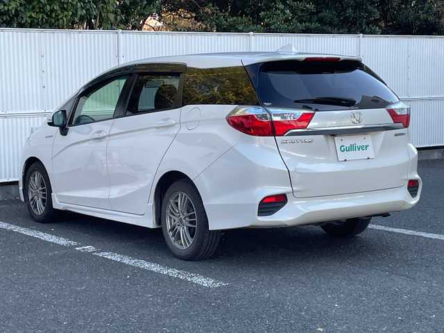 ホンダ シャトル ハイブリッド X ホンダセンシング 茨城県 2019(平31)年 7.5万km プラチナホワイトパール ワンオーナー/衝突軽減ブレーキ/純正SDナビ/FM/AM/CD/DVD/iPod/SD/USB/AUX/AppleCarPlay/Bluetooth接続/フルセグTV/ハーフレザーシート/シートヒーター（D＋N席）/レーダークルーズコントロール/バックカメラ/レーンキープアシスト/横滑り防止装置/アイドリングストップ/パドルシフト/ビルトインETC/LEDヘッドライト/保証書/取扱説明書