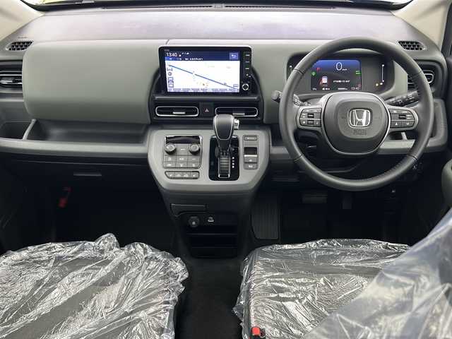 ホンダ フリード ハイブリット e:HEV クロスター 大阪府 2025(令7)年 0.1千km メテオロイドグレーメタリック 登録済未使用車/純正9インチSDナビ/【BT/フルセグTV/USB/AppleCarPlay/AndroidAuto]/バックカメラ/パワースライドドア　左/衝突被害軽減システム/ブラインドスポットモニター/コーナーセンサー前後/クルーズコントロール追従/オートライト/ハーフレザーシート　/シートヒータ　D+N席/スペアキー