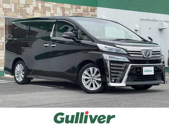 トヨタ ヴェルファイア Z 徳島県 2018(平30)年 5.3万km バーニングブラッククリスタルシャインガラスフレーク 純正メーカーナビ/(AM.FM.CD.DVD.BT.フルセグ)/JBLプレミアムサウンド/純正フリップダウンモニター/プッシュスタート/バックカメラ/ETC/フルセグTV/両側パワースライドドア/ドライブレコーダー/オットマン/横滑り防止装置/コーナーセンサー/レーンキープアシスト/オートライト/オートハイビーム/LEDヘッドライト