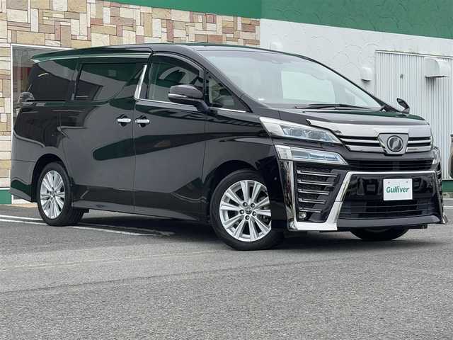 トヨタ ヴェルファイア Z 徳島県 2018(平30)年 5.3万km バーニングブラッククリスタルシャインガラスフレーク 純正メーカーナビ/(AM.FM.CD.DVD.BT.フルセグ)/JBLプレミアムサウンド/純正フリップダウンモニター/プッシュスタート/バックカメラ/ETC/フルセグTV/両側パワースライドドア/ドライブレコーダー/オットマン/横滑り防止装置/コーナーセンサー/レーンキープアシスト/オートライト/オートハイビーム/LEDヘッドライト