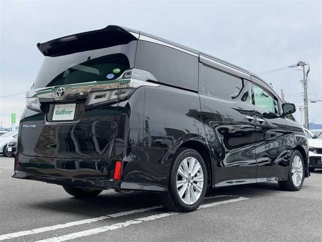 トヨタ ヴェルファイア Z 徳島県 2018(平30)年 5.3万km バーニングブラッククリスタルシャインガラスフレーク 純正メーカーナビ/(AM.FM.CD.DVD.BT.フルセグ)/JBLプレミアムサウンド/純正フリップダウンモニター/プッシュスタート/バックカメラ/ETC/フルセグTV/両側パワースライドドア/ドライブレコーダー/オットマン/横滑り防止装置/コーナーセンサー/レーンキープアシスト/オートライト/オートハイビーム/LEDヘッドライト