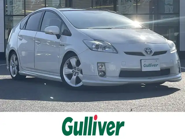 トヨタ プリウス G 岡山県 2009(平21)年 9.9万km ホワイトパールクリスタルシャイン 登録時走行距離98801km/サンルーフ/TOMSエアロ/純正ナビ/地デジTV(AM/FM/CD/DVD/Bluetooth)/バックカメラ/ETC/クルーズコントロール/オートライト/プッシュスタート/スマートキー/レーダー探知機/純正フロアマット/17インチ純正AW