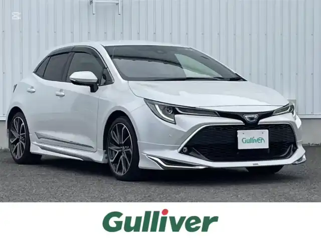 トヨタ カローラ スポーツ ハイブリッドG Z 熊本県 2022(令4)年 4.6万km プラチナホワイトパールマイカ ワンオーナー/純正ディスプレイオーディオ/・AM/FM/USB/BT/・AppleCarPlay/AndroidAuto/・フルセグTV/バックカメラ/トヨタセーフティセンス/・レーントレーシングアシスト/・プリクラッシュセーフティ/・クリアランスソナー/・パーキングサポートブレーキ/・ロードサインアシスト/・レーダークルーズコントロール/・オートマチックハイビーム/前後コーナーセンサー/革巻きステアリング/・ステアリングリモコン/ハーフレザーシート/・D/N席シートヒーター/オートライト/・LEDライト/・フォグランプ/・ヘッドライトレベライザー/MODELISTAフルエアロ/電動サイドブレーキ/・ホールドボタン/電動格納ミラー/・ウィンカーミラー/トノカバー/純正フロアマット/純正アルミホイール/純正ドアバイザー/スマートキー/・スペアキー