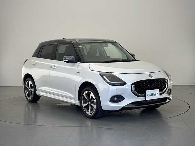 スズキ スイフト HYBRID MZ 長野県 2024(令6)年 1.3万km ピュアホワイトパール/ガンメタリック2トーン 4WD/ツートーン（ピュアホワイト×ガンメタリック）/純正ナビ/（フルセグ/Bluetooth/CD/DVD）/全方位モニター/衝突軽減ブレーキ/レーンキープアシスト/レーダークルーズコントロール/前後コーナーセンサー/ブラインドスポットモニター/前席シートヒーター/ステアリングスイッチ/電動パーキングブレーキ/パドルシフト/充電ポート/アイドリングストップ/MTモード付AT/スマートキー/スペアキー