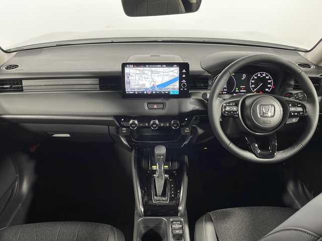 ホンダ ヴェゼル ハイブリッド e:HEV Z 広島県 2025(令7)年 0.1千km プラチナホワイトパール 登録済未使用車　４Km/純正９型ナビ/バックカメラ/シートヒーター(運転席/助手席)/レーダークルーズコントロール/ＥＴＣ2.0/ワイヤレス充電/ステアリングヒーター/ブラインドスポットモニター/電動リアゲート/アダブティブLEDヘッドライト/衝突被害軽減/レーンキープアシスト/踏み間違い防止/エアバッグ(運転席/助手席/サイド/カーテン)/純正18インチアルミホイール(225/50/R18)