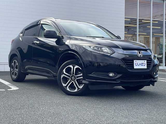 ホンダ ヴェゼル ハイブリッド Z 熊本県 2015(平27)年 10.3万km クリスタルブラックパール (株)IDOMが運営する【じしゃロン熊本店】の自社ローン対象車両になります。こちらは現金ご利用時の価格です。自社ローンご希望の方は別途その旨お申付け下さい。　/純正ナビ（VXM-152VFi）/バックカメラ/フルセグテレビ/DVD/CD/Bluetooth接続/ETC/ハーフレザーシート/シートヒーター/クルーズコントロール/LEDヘッドライト/オートライト/スマートキー/純正17インチアルミホイール