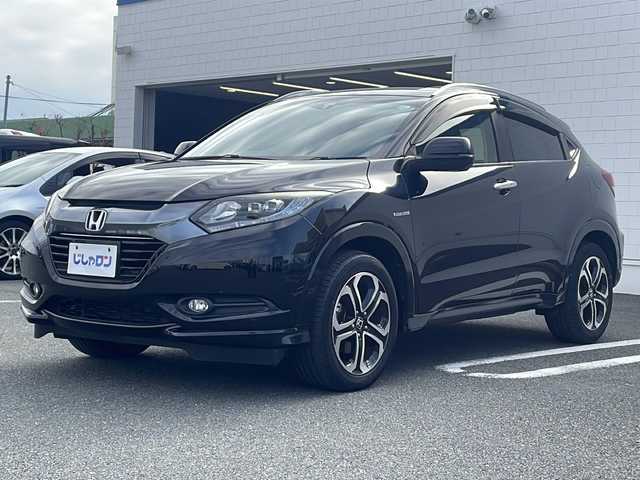 ホンダ ヴェゼル ハイブリッド Z 熊本県 2015(平27)年 10.3万km クリスタルブラックパール (株)IDOMが運営する【じしゃロン熊本店】の自社ローン対象車両になります。こちらは現金ご利用時の価格です。自社ローンご希望の方は別途その旨お申付け下さい。　/純正ナビ（VXM-152VFi）/バックカメラ/フルセグテレビ/DVD/CD/Bluetooth接続/ETC/ハーフレザーシート/シートヒーター/クルーズコントロール/LEDヘッドライト/オートライト/スマートキー/純正17インチアルミホイール
