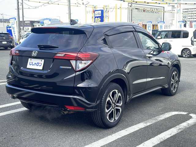 ホンダ ヴェゼル ハイブリッド Z 熊本県 2015(平27)年 10.3万km クリスタルブラックパール (株)IDOMが運営する【じしゃロン熊本店】の自社ローン対象車両になります。こちらは現金ご利用時の価格です。自社ローンご希望の方は別途その旨お申付け下さい。　/純正ナビ（VXM-152VFi）/バックカメラ/フルセグテレビ/DVD/CD/Bluetooth接続/ETC/ハーフレザーシート/シートヒーター/クルーズコントロール/LEDヘッドライト/オートライト/スマートキー/純正17インチアルミホイール