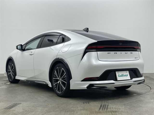 トヨタ プリウス Z 岡山県 2024(令6)年 0.4万km プラチナホワイトパールマイカ パノラマガラスルーフ/モデリスタエアロ（前・横・後下）	/純正１２．３インチディスプレイオーディオ	/【ナビ/フルセグ/Bluetooth/Carplay】	/パノラミックビューモニター	/追従型クルーズコントロール	/オートハイビーム	/LEDヘッドライト（AUTO機能付き）	/ビルトインETC２．０/デジタルインナーミラー/前席シートヒーター	/ステアリングヒーター/前席エアシート/運転席パワーシート	/衝突軽減ブレーキシステム	/車線逸脱防止システム	/横滑り防止装置/踏み間違い防止装置	/ブラインドスポットモニター/オートブレーキホールド/純正ドライブレコーダー（前後）	/純正19インチアルミ	/コーナーセンサー（前後）	/純正フロアマット	/ステアリングスイッチ	/ISOFIX/チルトステアリング/シートリフター/ウィンカーミラー/ドアバイザー/プッシュスタート	/新車保証書/スペアキー×1