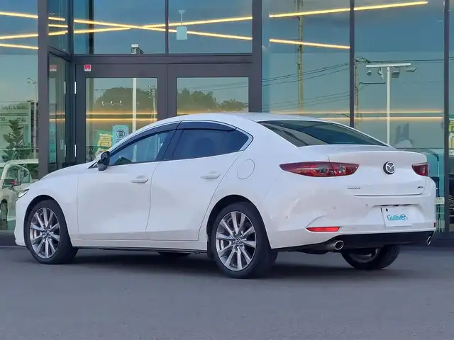 マツダ マツダ３セダン XD Lパッケージ 東京都 2019(令1)年 3.3万km スノーフレイクホワイトパールマイカ 純正SDナビ/全方位カメラ/衝突軽減ブレーキ/ブラインドスポットモニター/黒レザーシート/運転席パワーシート/ドライブレコーダー前後/ETC/パドルシフト/シートメモリー/レーダークルーズコントロール/シートヒーター/クリアランスソナー/ステアリングスイッチ/ハンドルヒーター/オートライト/LEDヘッドライト