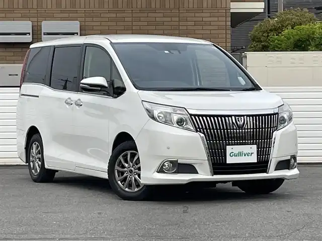 トヨタ エスクァイア Gi 群馬県 2016(平28)年 11.8万km ホワイトパールクリスタルシャイン 純正ナビ(NSZN-W64T)/(CD/DVD/SD/BT/フルセグTV)/バックカメラ/純正フリップダウンモニター/クルーズコントロール/ビルトイン2.0ETC/両側パワースライドドア/衝突軽減ブレーキ/レーンキープアシスト/MTモード付AT/前席シートヒーター/オートライト/電動格納ミラー＆ウインカーミラー/純正フロアマット/スマートキー×２/保証書＆取説