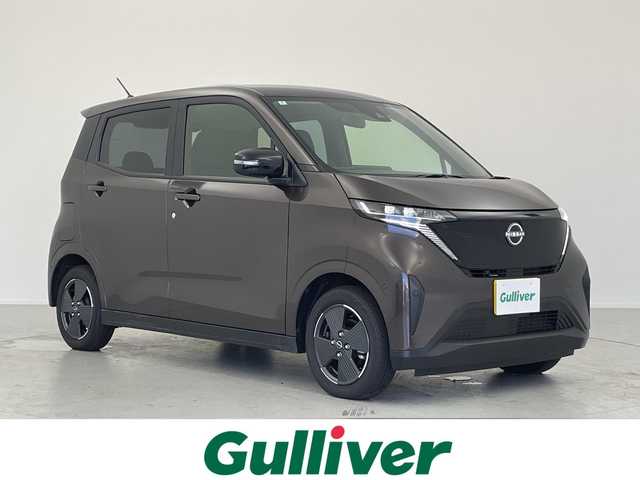 日産 サクラ X 愛知県 2024(令6)年 0.5万km アッシュブラウンM 純正ディスプレイオーディオ/・Bluetooth/・AppleCarPlay/・AndroidAuto/・HDMI/アラウンドビューモニター/プッシュスタート/電動パーキング/オートホールド機能/電動格納ミラー/純正フロアマット/オートライト/LEDヘッドライト/コーナーセンサー/純正14インチアルミホイール/エマージェンシーブレーキ/LDW（車線逸脱警報）