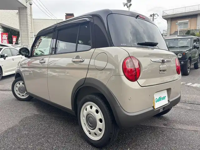 スズキ ラパン ＬＣ X 愛知県 2025(令7)年 0.3万km フォーンベージュメタリック/アーバンブラウン 2トーン SDナビ(ワンセグ/BT/USB/CD/AM/FM)/アラウンドビューモニター/バックカメラ/ETC/シートヒーター/ベンチシート/純正フロアマット/衝突被害軽減システム/ABS/横滑り防止装置/レーンキープアシスト/盗難防止装置/アイドリングストップ/オートライト/オートマチックハイビーム/電動格納式ミラー/コーナーセンサー/スペアキー/スマートキー/保証書/取扱説明書