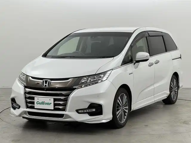 ホンダ オデッセイ ハイブリッド アブソルート・EXホンダセンジング 福岡県 2018(平30)年 4.9万km プラチナホワイトパール 純正ナビ（フルセグTV）/全方位カメラ　/後席モニター　/ビルトインＥＴＣ２．０　/前後ドライブレコーダー　/ホンダセンシング　/アダプティブクルーズコントロール　/コーナーセンサー　/衝突被害軽減ブレーキ　/レーンキープ　/ＢＳＭ　/パーキングアシスト　/先行車発進お知らせ　/標識認識機能　/両側電動スライドドア　/ハーフレザーシート　/シートヒーター