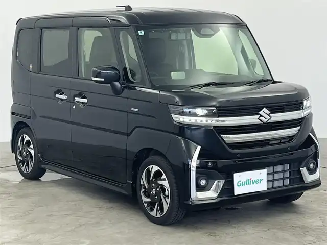スズキ スペーシア カスタム HYBRID XS 愛知県 2024(令6)年 0.8万km ブルーイッシュブラックパール3 社外7型SDナビ/（フルセグTV/CD/DVD/SD/BT）/バックカメラ/ハーフレザーシート/前席シートヒーター/ステアリングヒーター/デジタルインナーミラー/衝突軽減システム/レーンアシスト/コーナーセンサー/ヘッドアップディスプレイ/オートマチックハイビーム/カーテンエアバッグ/両側パワースライドドア/純正15インチAW/純正LEDヘッドライト/フロアマット/カーテンエアバッグ