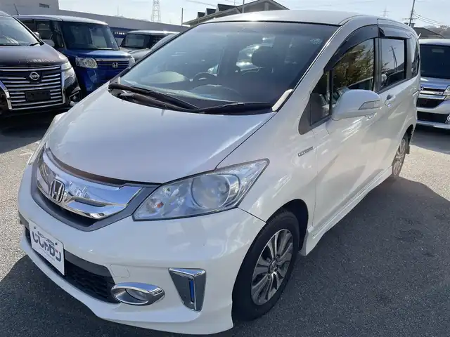 ホンダ フリード ハイブリット ジャストセレクション 兵庫県 2012(平24)年 9.9万km プレミアムホワイトパール 【(株)IDOMが運営する【じしゃロン姫路店】の自社ローン対象車両になります。こちらは現金ご利用時の価格です。自社ローンご希望の方は別途その旨お申付け下さい。】/純正ナビ/DVD/CD/MSV/ワンセグTV/バックカメラ/両側パワースライドドア/純正HIDヘッドライト/純正フォグランプ/オートライト/ハーフレザーシート/革巻きステアリング/ステアリングスイッチ/クルーズコントロール/ウッド調パネル/横滑り防止/スマートキー×２/ビルトインETC/純正フロアマット/純正ドアバイザー/電動格納ウインカードアミラー