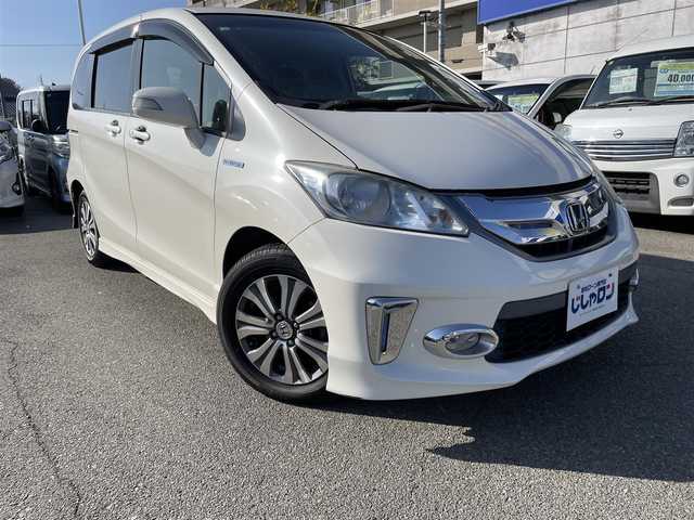 ホンダ フリード ハイブリット ジャストセレクション 兵庫県 2012(平24)年 9.9万km プレミアムホワイトパール 【(株)IDOMが運営する【じしゃロン姫路店】の自社ローン対象車両になります。こちらは現金ご利用時の価格です。自社ローンご希望の方は別途その旨お申付け下さい。】/純正ナビ/DVD/CD/MSV/ワンセグTV/バックカメラ/両側パワースライドドア/純正HIDヘッドライト/純正フォグランプ/オートライト/ハーフレザーシート/革巻きステアリング/ステアリングスイッチ/クルーズコントロール/ウッド調パネル/横滑り防止/スマートキー×２/ビルトインETC/純正フロアマット/純正ドアバイザー/電動格納ウインカードアミラー