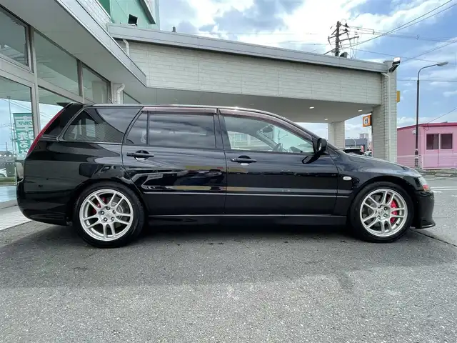 三菱 ランサー ワゴン GT－A エボリューション 青森県 2005(平17)年 13.2万km アメジストブラック 4WD/bremboブレーキキャリパー/MOMOステアリング/TEIN車庫調/Defiメーター/Recaroシート/HKSサイレントハイパワーマフラー/ACD(R6年ユニット交換済み）/17インチ純正アルミホイール/R6年車検時ヘッドライト/ディスクローター交換済み/社外エンジンスターター/社外オーディオ（BlueTooth/CD/ラジオ）/R2年102153キロ時タイミングベルト交換/取扱説明書/保証書
