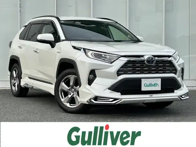 トヨタ ＲＡＶ４ ハイブリットG 福岡県 2019(令1)年 8.3万km ホワイトパールクリスタルシャイン ・純正ナビ　9インチ/（BLUETOOTH/フルセグ/バックカメラ/DVD再生/・ワンオーナー/・ETC/・クルーズコントロール/・コーナーセンサー/・クリアランスソナー/・衝突軽減システム/・レーンキープアシスト/・電動リアゲート/・電動格納ミラー/・純正フロアマット/・CDチェンジャー/・ドアバイザー/・プッシュスタート/・AC100V/・保証書/・取扱説明書