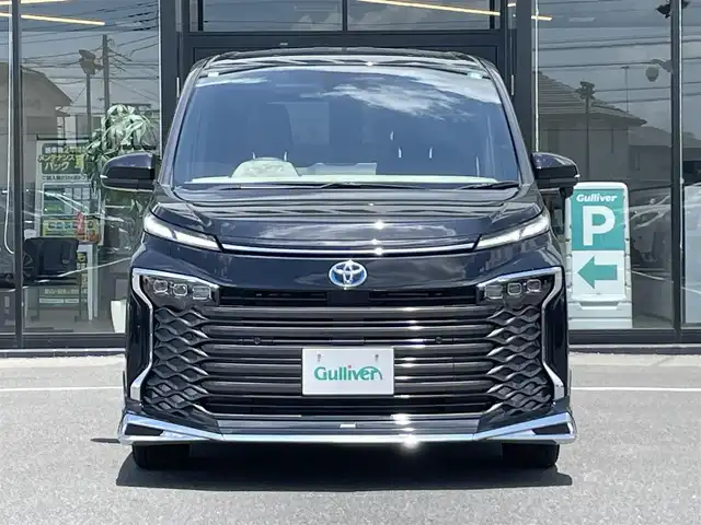 トヨタ ヴォクシー ハイブリッド S－Z 茨城県 2024(令6)年 0.3万km アティチュードブラックマイカ 純正ナビ/【AM・FM・TV・BT・USB】/シートヒーター/100V電源/レーダークルコン/Bカメラ/ETC2.0/前後コーナーセンサー/フロントエアロパーツ/両側パワスラ/ブレーキホールド/オートライト/オートハイビーム/LEDライト/純正フロアマット/純正アルミホイール/横滑り防止装置/レーンキープアシスト/衝突被害軽減システム/ステリモ