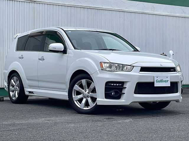 三菱 アウトランダー ナビコレ ROADEST 24G 徳島県 2011(平23)年 11.3万km ピュアホワイトP HDDナビ　J-05/バックカメラ/ETC/LEDヘッドライト/ハーフレザーシート/純正サイドエアロ/純正18インチアルミホイール/パドルシフト/純正フロアマット/純正ドアバイザー/ステアリングリモコン/センターコンソール/取扱説明書