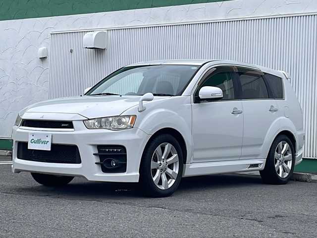 三菱 アウトランダー ナビコレ ROADEST 24G 徳島県 2011(平23)年 11.3万km ピュアホワイトP HDDナビ　J-05/バックカメラ/ETC/LEDヘッドライト/ハーフレザーシート/純正サイドエアロ/純正18インチアルミホイール/パドルシフト/純正フロアマット/純正ドアバイザー/ステアリングリモコン/センターコンソール/取扱説明書