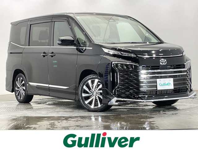 トヨタ ヴォクシー S－Z 栃木県 2023(令5)年 0.7万km アティチュードブラックマイカ 純正メモリナビ/（CD/DVD/フルセグTV/Bluetooth/USB/Miracast）/バックカメラ/モデリスタエアロ/純正フリップダウンモニター/トヨタセーフティセンス/コーナーセンサー/ビルトインETC2.0/前後ドライブレコーダー/両側パワースライドドア/パワーバックドア/ハーフレザーシート/前席シートヒーター/オートライト/LEDヘッドライト/横滑り防止装置/スマートキー/プッシュスタート/ステアリングスイッチ/革巻きステアリング/ウィンカーミラー/純正17インチアルミホイール/フロアマット