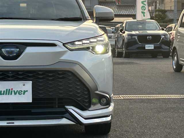 トヨタ カローラ クロス ハイブリッド Z 広島県 2023(令5)年 7万km プラチナホワイトパールマイカ ワンオーナー/純正メモリナビ/　（Bluetooth/フルセグテレビ/AM/FM）/レーダークルーズコントロール/モデリスタエアロ/全方位モニター/ブラインドスポットモニター/電子パーキング/オートブレーキホールド/ビルトインETC/パワーシート/シートヒーター/純正18インチアルミホイール/ルーフレール/純正フロアマット/コーナーセンサー/レーンキープアシスト/横滑り防止装置/衝突被害軽減システム/オートマチックハイビーム/LEDヘッドライト/フォグランプ/カーテンエアバック/スペアキー/保証書/取扱説明書