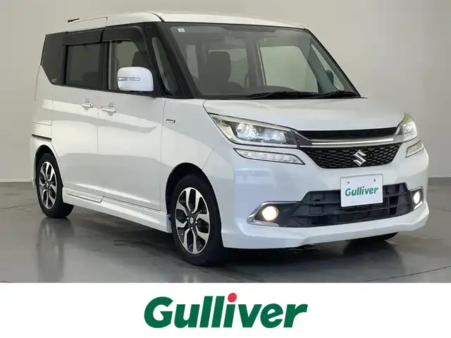 スズキ ソリオ バンディット HV MV Dカメラ ブレーキS 愛知県 2017(平29)年 5.8万km ピュアホワイトP 純正ナビ　フルセグＴＶ　Ｂｌｕｅｔｏｏｔｈ　ＵＳＢ　シートヒーター　両側パワースライドドア　デュアルカメラブレーキ　衝突軽減　車線逸脱　クルコン　ＬＥＤオートライト　プッシュスタート　フォグランプ　TVキャンセラー　禁煙車