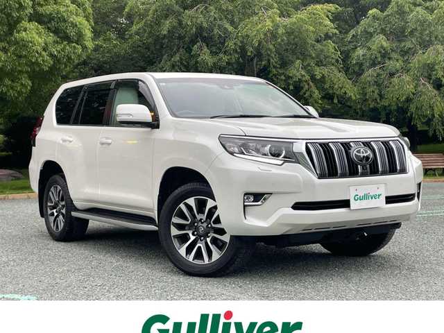 トヨタ ランドクルーザー プラド TZ－G 静岡県 2022(令4)年 2.4万km ホワイトパールクリスタルシャイン トヨタセーフティセンス/ターボ/純正9型メーカーナビ/・フルセグTV/BTオーディオ/USB/全方位カメラ/ビルトインETC2.0/ドラレコ前方/サンルーフ/ベージュ革/メモリーシート/パワーシートD/N/シートヒーターD/N/シートクーラーD/N/三列シート/電動格納シート/パドルシフト/LEDヘッドランプ/フォグランプ/純正フロアマット/ドアバイザー/スマートキー/スペアキー/保証書/取扱説明書/純正19アルミホイール