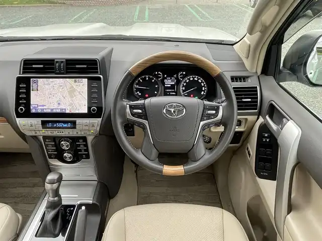 トヨタ ランドクルーザー プラド TZ－G 静岡県 2022(令4)年 2.4万km ホワイトパールクリスタルシャイン トヨタセーフティセンス/ターボ/純正9型メーカーナビ/・フルセグTV/BTオーディオ/USB/全方位カメラ/ビルトインETC2.0/ドラレコ前方/サンルーフ/ベージュ革/メモリーシート/パワーシートD/N/シートヒーターD/N/シートクーラーD/N/三列シート/電動格納シート/パドルシフト/LEDヘッドランプ/フォグランプ/純正フロアマット/ドアバイザー/スマートキー/スペアキー/保証書/取扱説明書/純正19アルミホイール