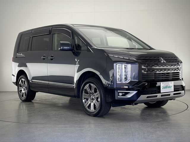 三菱 デリカＤ：５ ジャスパー 宮崎県 2023(令5)年 1.2万km グラファイトグレーメタリック/ブラックマイカ 禁煙車/衝突被害軽減ブレーキ/純正10.1型ナビ/（CD/DVD/Bluetooth/MSV/HDMI/AUX)/純正LEDオートライト/純正LEDフォグ/純正18インチアルミ/純正フロアマット/社外革調シートカバー/社外ドライブレコーダー/両側電動スライドドア/パワーバックドア/アダプティブクルーズコントロール/レーンディパーチャーアラート/ブラインドスポットモニター/パノラミックビューモニター/電子パーキング/オートホールド/クリアランスソナー/パドルシフト/ステアリングヒーター/デュアルオートエアコン/本革巻ハンドル/運転席パワーシート/前席シートヒーター/スマートキー/プッシュエンジンスタート/新車時保証書/取扱い説明書