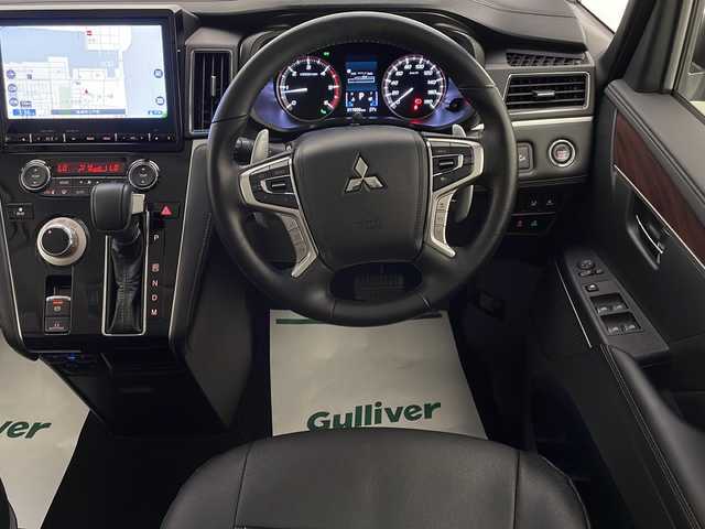 三菱 デリカＤ：５ ジャスパー 宮崎県 2023(令5)年 1.2万km グラファイトグレーメタリック/ブラックマイカ 禁煙車/衝突被害軽減ブレーキ/純正10.1型ナビ/（CD/DVD/Bluetooth/MSV/HDMI/AUX)/純正LEDオートライト/純正LEDフォグ/純正18インチアルミ/純正フロアマット/社外革調シートカバー/社外ドライブレコーダー/両側電動スライドドア/パワーバックドア/アダプティブクルーズコントロール/レーンディパーチャーアラート/ブラインドスポットモニター/パノラミックビューモニター/電子パーキング/オートホールド/クリアランスソナー/パドルシフト/ステアリングヒーター/デュアルオートエアコン/本革巻ハンドル/運転席パワーシート/前席シートヒーター/スマートキー/プッシュエンジンスタート/新車時保証書/取扱い説明書