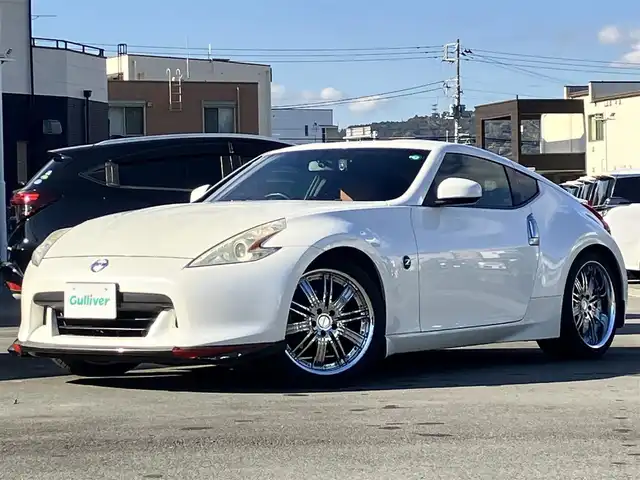 日産 フェアレディ Ｚ バージョンT 静岡県 2011(平23)年 10万km ブリリアントホワイトパール HKSハイパフォーマンスエキゾーストマフラー/WORK Varianza19インチアルミホイール /純正ナビ（CD/フルセグ）/バックカメラ/ドライブレコーダー前後/ETC/パドルシフト/エンジンスタートボタン/パワーステアリング/パワーウィンドウ/スマートキー/オートエアコン/フロアマット/D席N席パワーシート/D席N席シートヒーター/ハーフレザーシート（本革＆布）/フロントエアロ/ABS/横滑り防止装置/オートライト/キセノン/W+サイドエアバッグ/BOSE/ブルーレンズミラー