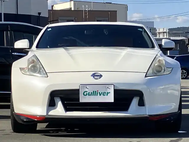 日産 フェアレディ Ｚ バージョンT 静岡県 2011(平23)年 10万km ブリリアントホワイトパール HKSハイパフォーマンスエキゾーストマフラー/WORK Varianza19インチアルミホイール /純正ナビ（CD/フルセグ）/バックカメラ/ドライブレコーダー前後/ETC/パドルシフト/エンジンスタートボタン/パワーステアリング/パワーウィンドウ/スマートキー/オートエアコン/フロアマット/D席N席パワーシート/D席N席シートヒーター/ハーフレザーシート（本革＆布）/フロントエアロ/ABS/横滑り防止装置/オートライト/キセノン/W+サイドエアバッグ/BOSE/ブルーレンズミラー