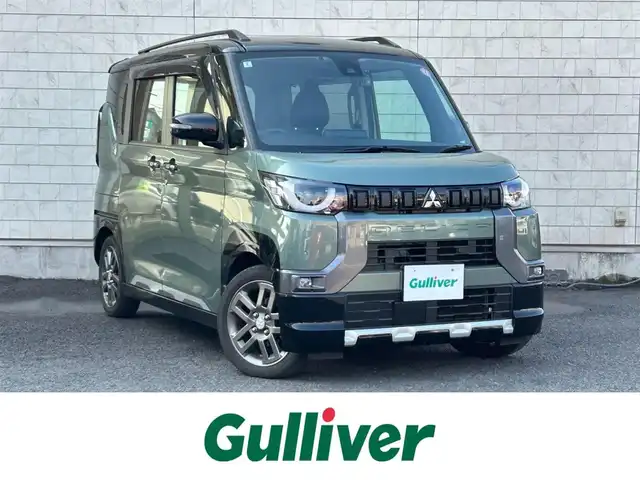 三菱 デリカミニ T プレミアム 大分県 2024(令6)年 2.9万km 緑 〇ワンオーナー/〇ハーフレザーシート/〇純正メモリーナビ（MM223D-LM）/　ラジオ・BT・USB/〇全方位カメラ/〇ETC/〇純正LEDヘッドライト/〇純正フォグランプ/〇スマートキー/〇エンジンプッシュスタート/〇パドルシフト/〇ACC/〇LKA/〇MI-PILOT/〇両側パワースライドドア/〇ルーフレール/〇アイドリングストップ/〇ステアリングヒーター/〇ステアリングスイッチ/〇フロアマット/〇ドアバイザー/〇プライバシーガラス/〇前後ドライブレコーダー/〇ウインカーミラー/〇保証書/〇取扱説明書/〇スペアキー
