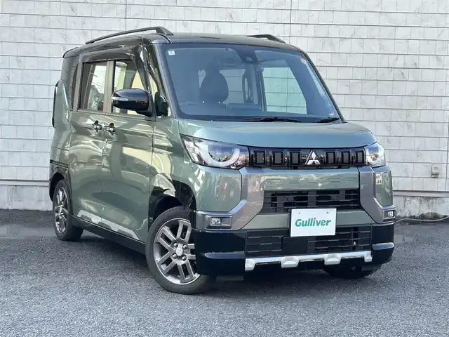 三菱 デリカミニ T プレミアム 大分県 2024(令6)年 2.9万km 緑 〇ワンオーナー/〇ハーフレザーシート/〇純正メモリーナビ（MM223D-LM）/　ラジオ・BT・USB/〇全方位カメラ/〇ETC/〇純正LEDヘッドライト/〇純正フォグランプ/〇スマートキー/〇エンジンプッシュスタート/〇パドルシフト/〇ACC/〇LKA/〇MI-PILOT/〇両側パワースライドドア/〇ルーフレール/〇アイドリングストップ/〇ステアリングヒーター/〇ステアリングスイッチ/〇フロアマット/〇ドアバイザー/〇プライバシーガラス/〇前後ドライブレコーダー/〇ウインカーミラー/〇保証書/〇取扱説明書/〇スペアキー