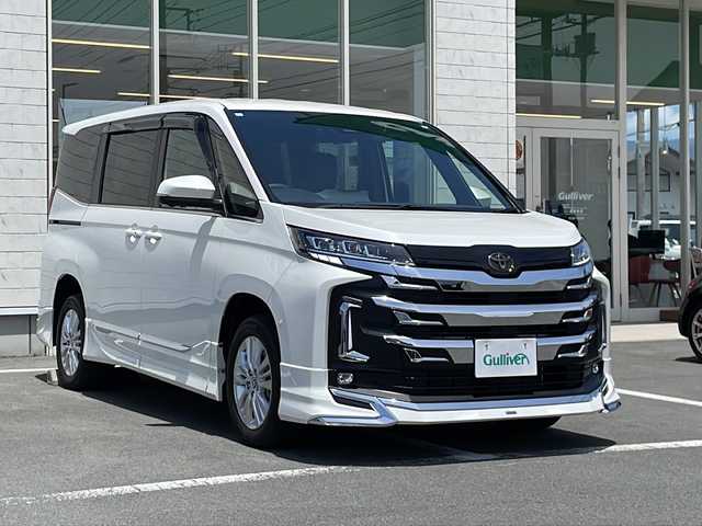 トヨタ ノア ハイブリッド S－Z 静岡県 2024(令6)年 0.1万km ホワイトパールクリスタルシャイン スマートキー/プッシュスタート/純正10.5インチナビ/　フルセグTV/BTオーディオ/Miracast/DVD/全方位カメラ/デジタルインナーミラー/4WD/寒冷地仕様/ハンドルヒーター/ステアリングスイッチ/AC100V電源/オートホールド/パーキングアシスト/前後コーナーセンサー/LEDヘッドライト