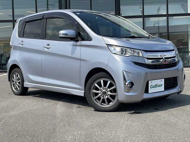 三菱 ｅＫカスタム G 青森県 2015(平27)年 5.6万km クールシルバーメタリック ・４WD/・純正フルセグナビTV/・AM/FM/Bluetooth/CD/DVD/・純正エンジンスターター/・純正フロアマット/・D席シートヒーター/・バックカメラ/・アイドリングストップ/・純正ドアバイザー/・スペアキー/・バニティミラー/・プッシュスタート/・純正AWスタットレスアルミセット積み込み14インチ/・保証書/・取扱説明書
