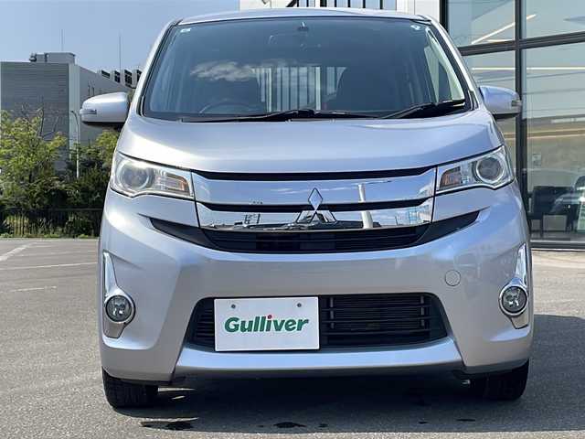 三菱 ｅＫカスタム G 青森県 2015(平27)年 5.6万km クールシルバーメタリック ・４WD/・純正フルセグナビTV/・AM/FM/Bluetooth/CD/DVD/・純正エンジンスターター/・純正フロアマット/・D席シートヒーター/・バックカメラ/・アイドリングストップ/・純正ドアバイザー/・スペアキー/・バニティミラー/・プッシュスタート/・純正AWスタットレスアルミセット積み込み14インチ/・保証書/・取扱説明書