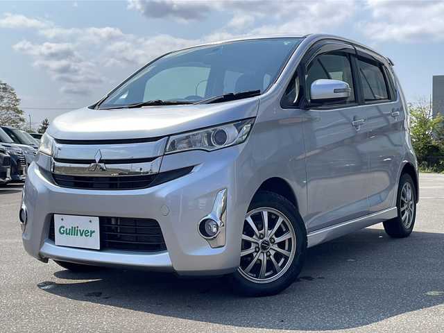 三菱 ｅＫカスタム G 青森県 2015(平27)年 5.6万km クールシルバーメタリック ・４WD/・純正フルセグナビTV/・AM/FM/Bluetooth/CD/DVD/・純正エンジンスターター/・純正フロアマット/・D席シートヒーター/・バックカメラ/・アイドリングストップ/・純正ドアバイザー/・スペアキー/・バニティミラー/・プッシュスタート/・純正AWスタットレスアルミセット積み込み14インチ/・保証書/・取扱説明書