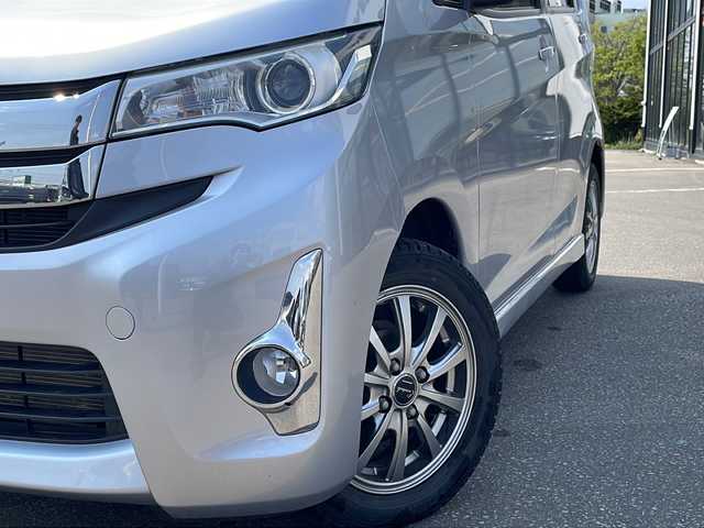 三菱 ｅＫカスタム G 青森県 2015(平27)年 5.6万km クールシルバーメタリック ・４WD/・純正フルセグナビTV/・AM/FM/Bluetooth/CD/DVD/・純正エンジンスターター/・純正フロアマット/・D席シートヒーター/・バックカメラ/・アイドリングストップ/・純正ドアバイザー/・スペアキー/・バニティミラー/・プッシュスタート/・純正AWスタットレスアルミセット積み込み14インチ/・保証書/・取扱説明書